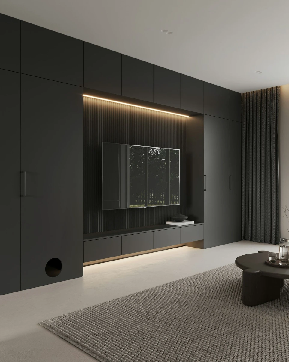 A living room with a couch, coffee table and television